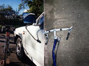bicycle's right handlebar hooked up by ute's left edge of bullbar