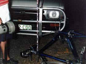 bicycle's right handlebar hooked up by ute's left edge bullbar